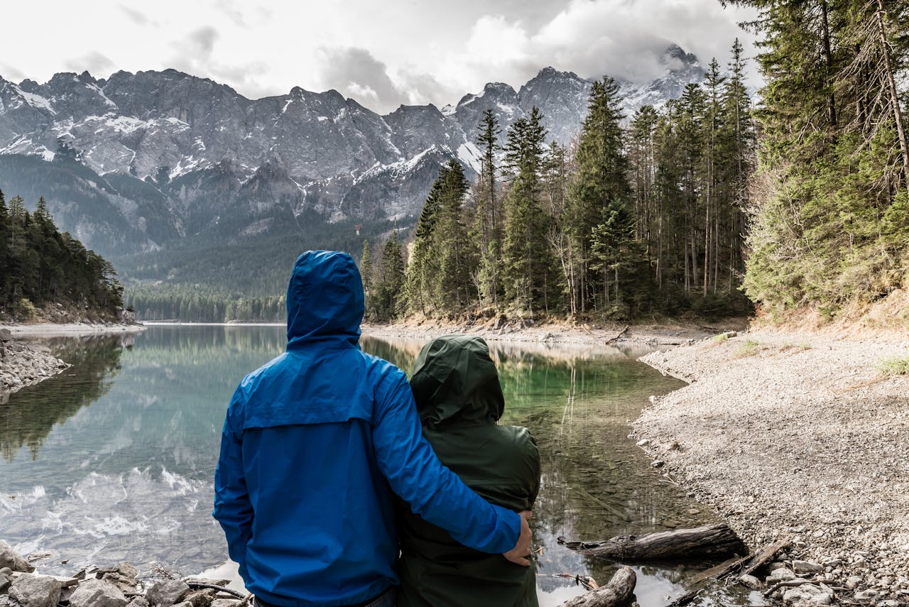 The Art of Drawing Readers In: Your attractive post title goes here Romantic couple hugging and admiring the view of a mountain lake in Grainau, Germany.
